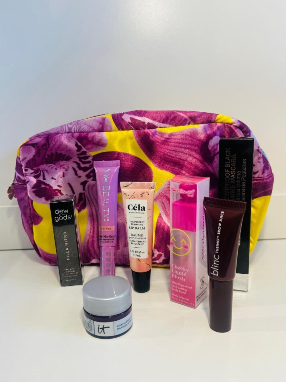 Cosmetic bag with makeup and skincare products (Full, Travel and Sample Sizes)